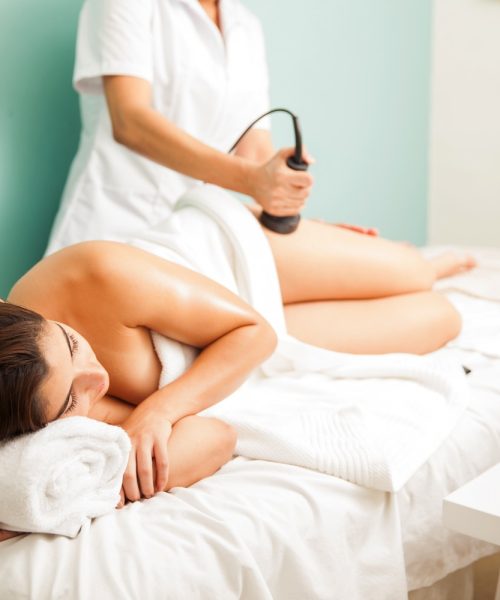 full-length-view-young-woman-getting-anticellulite-reductive-body-treatment-health-beauty-spa