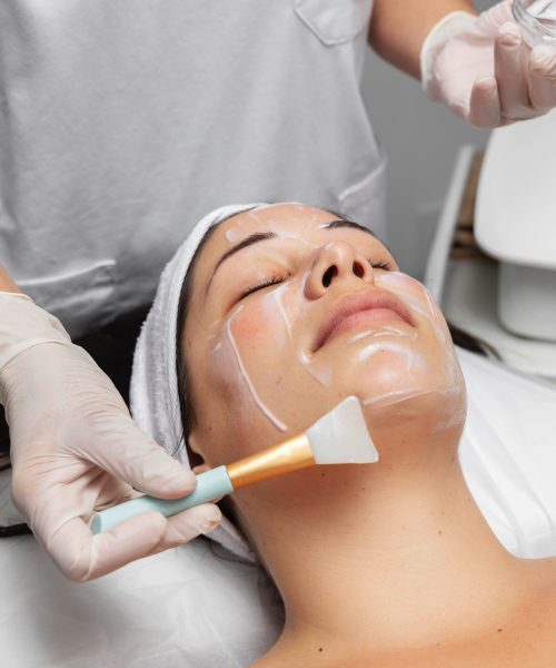 young-woman-having-facial-skincare-treatment
